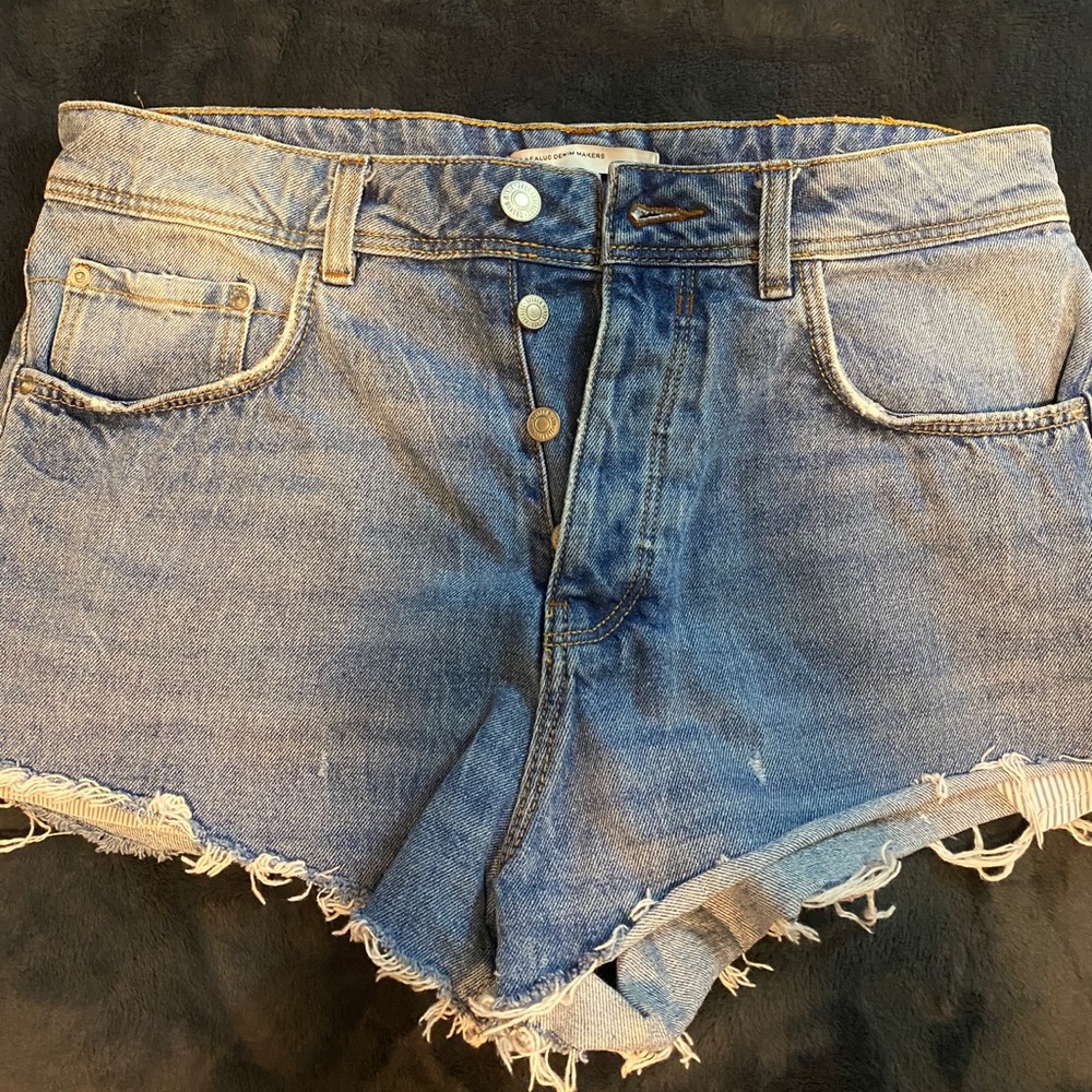 Blue Jean high waisted shorts with frayed bottoms